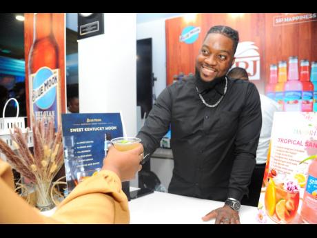 Mixologist Orane Edwards serves the sweet Kentucky moon mix, made with Blue Moon Beer.