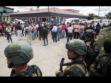 Police guard the entrance to the women’s prison in Tamara, on the outskirts of Tegucigalpa, Honduras, on Tuesday, June 20. A riot at the women’s prison northwest of the Honduran capital has left at least 41 inmates dead, most of them burned to death, a