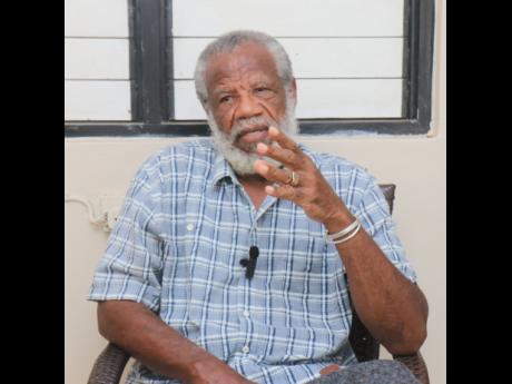 Credit: Ashley Anguin Carl Hill, a former gang member who is now a screenplay writer and children’s book author, gets emotional as he reflects on his past gang activities during an interview at his home in Greenwood, St James, on June 22.