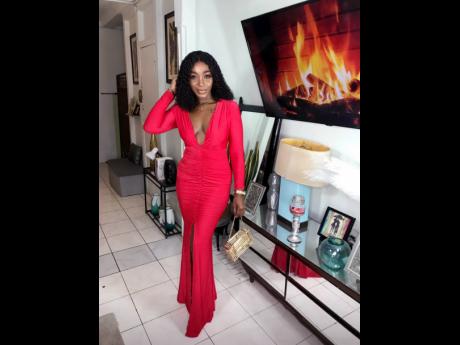 Credit: Contributed Painting the town red for a formal occasion, Tucker turns heads in this radiant dress with a plunging V-shaped neckline.