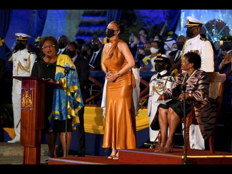 Barbados’ Prime Minister Mia Mottley (left) and President Dame Sandra Mason (right) honour Rihanna as a national hero during the presidential inauguration ceremony in Bridgetown, Barbados, in November 2021. 