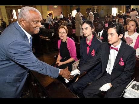Glen Christian (left), chairman and CEO of Cari-Med Group greets (from second left), Dr Eileen Chin, widow of Lescelles Chin and children David, (centre) and Richard at the service of thanksgiving for the life of Lascelles Chin at Cathedral of The Most Hol