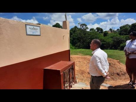 Minister without Portfolio in the Ministry of Economic Growth and Job Creation Senator Matthew Samuda commissions the Albert Town High School Rainwater Harvesting System in Trelawny, on Thursday.