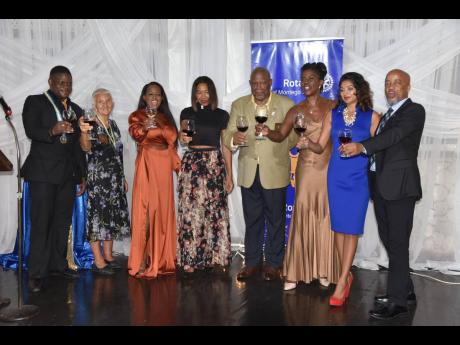 From left; Paul G. Thompson, president of the Rotary Club of Montego Bay, celebrates with a fraction of new members of his board: vice-president, Dominica Pradere; secretary, Amber-Gail Grandison; treasurer, Karen Burgess; Denton Campbell, fundraising dire
