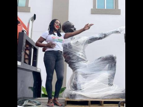Credit: 4alexandradavis Alexandra Davis, vice mayor of Miramar, with the soon-to-be unveiled statue of Usain Bolt.