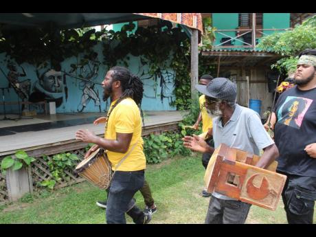 Ras Padam (left) leading the procession into Asafu Yard at Charles Town, Portland during the recent 15th Annual International Charles Town Maroon Conference and Festival.