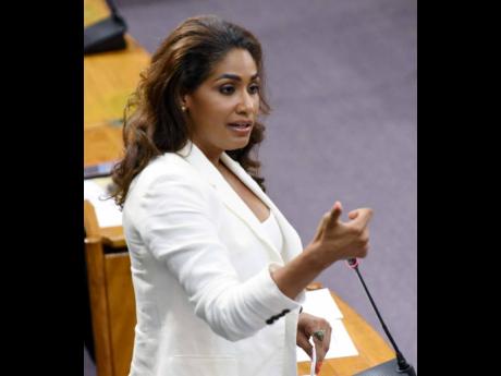 Lisa Hanna, Member of Parliament, St Ann South Eastern, speaks about delaying discussions to amend an amendment the Child Care Protection Act in the House of representatives yesterday.