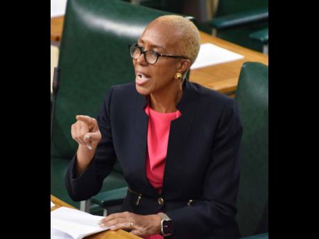 Fayval Williams, Minister of Education and Youth, speaks in the House of Representatives yesterday while addressing the delayed amendment of the Child Care and Protection Act.