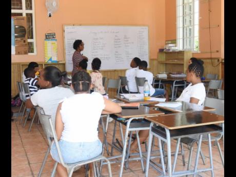 Students during comprehension class at summer school at Whitter’s Institute in Westgate Hills, Montego Bay.
