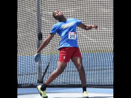Clarendon College's Joseph Salmon throws 49.95 metres to win the Under-18 boys' discus at the National Senior and Junior Athletics Championship at the National Stadium today.