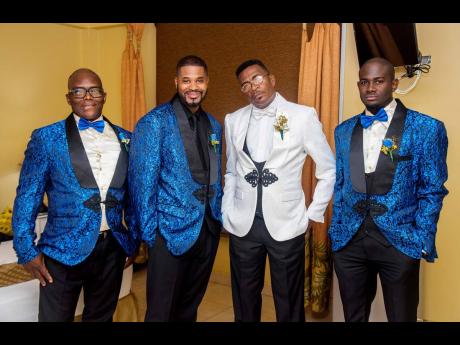 Decked out in black and white, the groom was joined by his supportive band of brothers suited in black, white and blue.