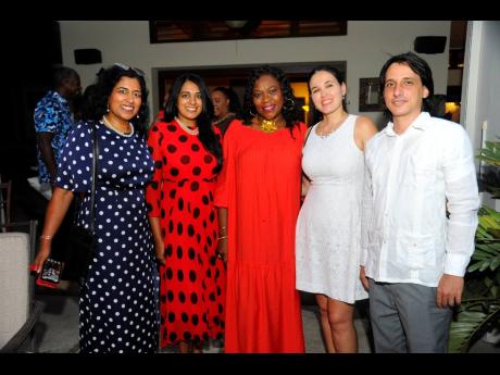 From left: Alifya Bharmal, British Diplomat Anisah Dathi and wife of the Opposition Leader Sandra Golding pose with Cuban Embassy officials Anabel Landrón and Rolando Davila.