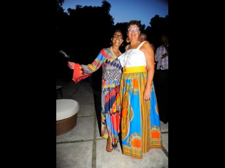 Fifty years of history culminating into one snap, the Women’s Movement’s founding chairman (left) Beverley Manley-Duncan poses with current chairman Patricia Duncan-Sutherland.