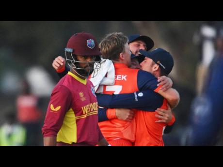 Credit: Photo courtesy of @ICC
West Indies captain Shai Hope (left) looks away as the Netherlands players celebrate their stunning win over the West Indies in the Group A match of the ICC World Cup Qualifier at Takashinga Sports Club in Zimbabwe recently.