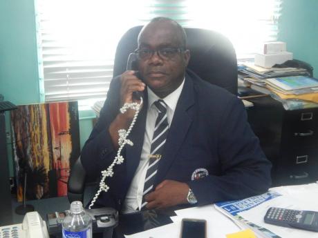 Wayne Robinson, acting principal of Jamaica  College. 