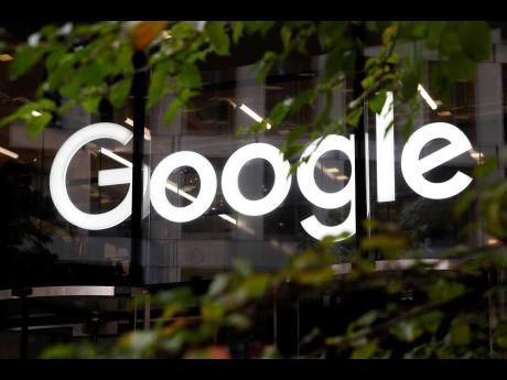 Credit: AP Alastair Grant The Google logo is displayed at their offices in London.