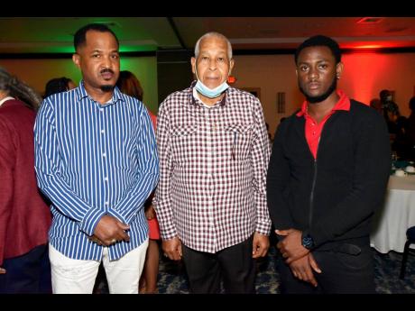 Credit: File From left: Lloyd ‘John John’ James, son of Lloyd ‘King Jammy’ James and Romeo Facey, pose for a photo at the Watch Party: Reggae on the Pier held in 2022.
