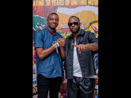 Red Stripe Junior Brand Manager Arnaldo Martin (left) applauded dancehall artiste Teejay on an epic performance.