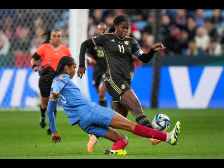 Jamaica’s Khadija Shaw (right)  battles for the ball with France’s Wendie Renard during the Women’s World Cup Group F match between France and Jamaica at the Sydney Football Stadium in Sydney, Australia, Sunday, July 23, 2023. 