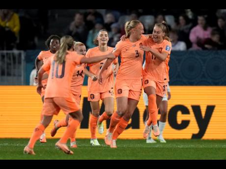 Netherlands’ Stefanie Van der Gragt (second right) celebrates with teammates after scoring during the first half of the FIFA Women’s World Cup Group E match between the Netherlands and Portugal in Dunedin, New Zealand, Sunday, July 23, 2023. 