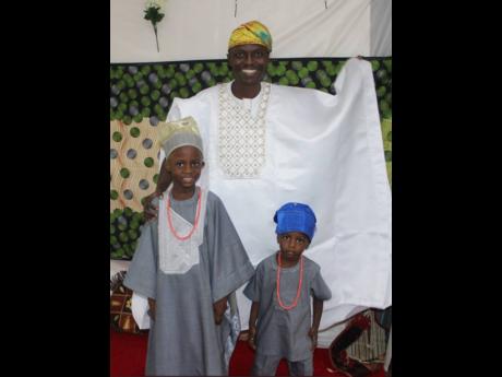 Bamgbose Oluwaseyi and his sons, Joshua (left) and Caleb went for the full regalia. 