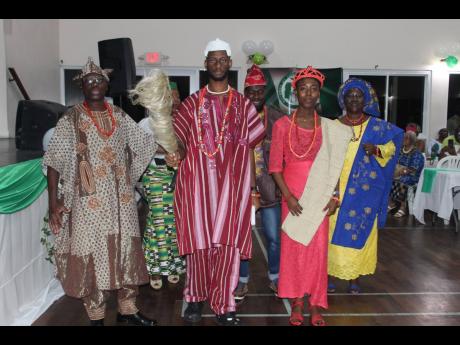 From left: The ‘coronation party’ of Shamsideen Kenshinro, Susan Salako (partially hidden), Ahmed Ajagunna (‘the king’), Monsour Olawale Zakariyah, Christabel Agboola (‘the queen’) and Bola Mary Agoola (‘the king’s mother’) retreats after