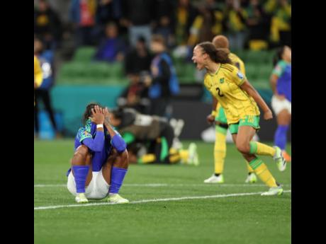 The Reggae Girlz celebrate after reaching the last 16 of the 2023 FIFA Women’s World Cup in Melbourne, Australia, on Wednesday.  Jamaica drew 0-0 with Brazil and advanced after placing second in Group F. Brazil were eliminated. 