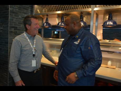 Credit: Janet Silvera Mark Sutherland (left), vice-president, Express Caterings and Executive Chef, Dwayne Bell of Bob Marley’s One Love Restaurant.
