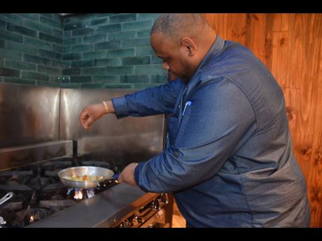 Credit: Janet Silvera Executive chef Dwayne Bell preparing an Ital stew for The Gleaner team.