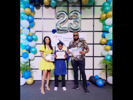 Twelve-year-old LeBron Anderson who is the top achiever in western Jamaica in the Primary Exit Profile (PEP) examinations (centre) with mother, Tamone Barrett, and father, Mark Anderson.