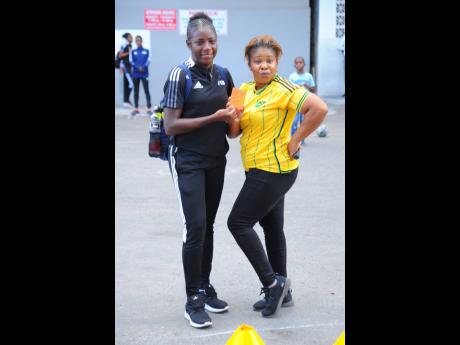 Celia Ffrench (right) shows off the autograph received from International Referee Odette Hamilton (left), at the Reggae Girlz pre-game show, at JFF headquarters, St Lucia Crescent, New Kingston on July 28, 2023.