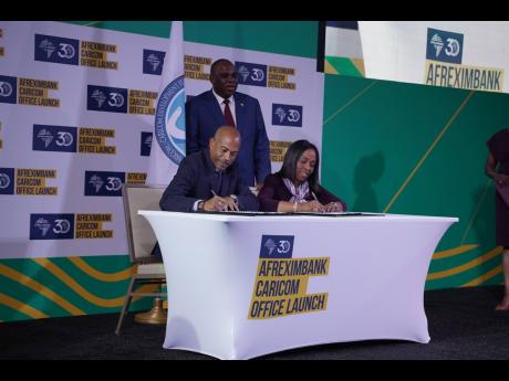 The CDF’s Chief Executive Officer, Rodinald Soomer (seated left), and Afreximbank’s Executive Vice President, Kanayo Awani, signing the MOU documents recently. Looking on is Afreximbank’s President and Chairman of the Board of Directors, Benedict Ora