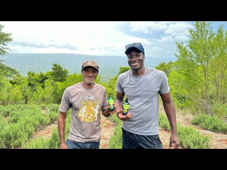 Settled in the Manchester hills, local farmer Melbourne Mead (left), poses with his chief supporter Javin Williams. 