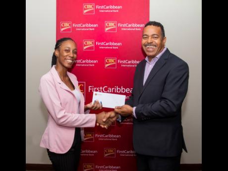CIBC FirstCaribbean has given support to the Jamaicans for Justice (JFJ) programmes against gender-based violence. Here, Davia Ruddock (left), of Jamaicans For Justice, accepts the bank’s cheque from Managing Director Nigel Holness. The JFJ initiatives a