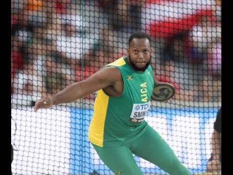 Getting it done! Traves Smikle throws the discus over 65 metres to land himself in the competition’s final.