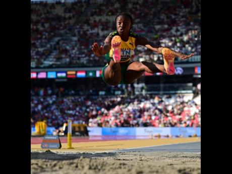 Credit: Gladstone Taylor Jamaica's Ackelia Smith launches herself into the sandpit at the National Athletics Centre in Budapest, Hungary during the World Athletics Championships women's long jump final earlier today.