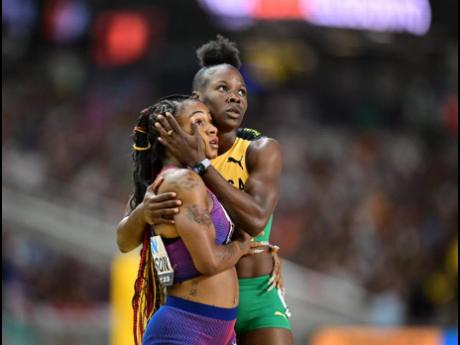 Jamaica’s Shericka Jackson (right) and United States of America’s Sha’Carri Richardson congratulate each other after finishing first and second, respectively, in their semi-final heat at the World Athletics Championships in Budapest, Hungary today.