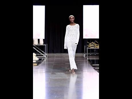 SAINT star Nickosha Arnold-Johansen closing the Wooding collection in Look 35 – an open-knit maxi dress – at the Oslo Runway designer presentations.