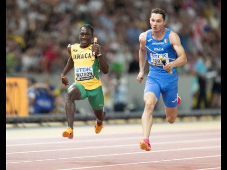 Gladstone Taylor/Multimedia Photo Editor 
Jamaica’s Rohan Watson (left) goes in hunt of a medal during the men’s 4x100 metres at the World Athletics Championships in Budapest, Hungary.   