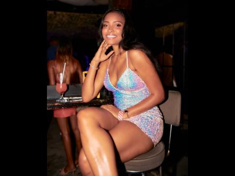 Robyn Kiira Lloyd, Miss Universe Jamaica first runner-up, serves a winning look in this iridescent pink sequin number.
