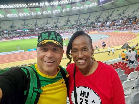 Credit: Janet Silvera Robert Richards poses with Olympian Jackie Joyner Kersee.