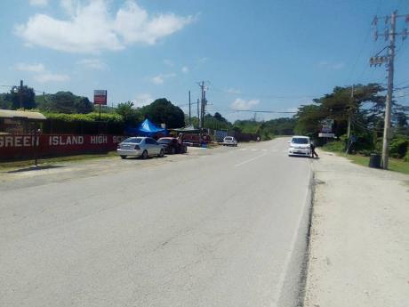 Photo shows cleared sidewalk outside the Green Island High School in Hanover