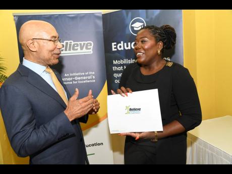 Governor General Sir Patrick Allen congratulates Karyl Thorpe, one 10 awardees of the I Believe Initiative’s Summer of Service scholarships, at a presentation ceremony at King’s House in St Andrew on Thursday.