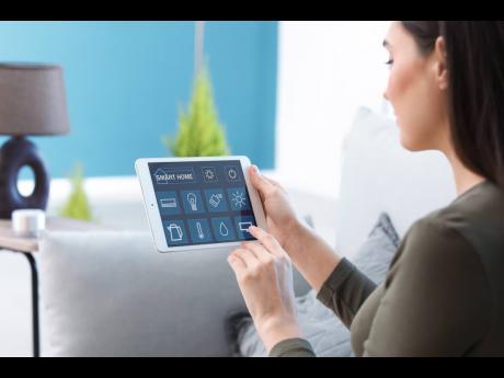 Representational image of a young woman using application of smart home automation.