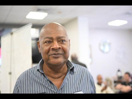 Credit: File Inset: JFF President Michael Ricketts