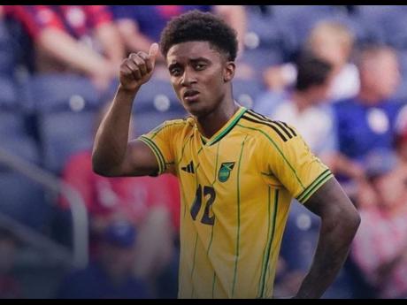 Reggae Boy Demarai Gray celebrates scoring one of his two goals during a man-of-the-match Gold Cup performance against Trinidad and Tobago at City Park in the United States.