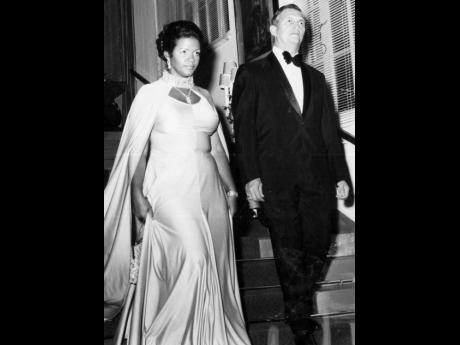 Then Leader of the Opposition, Edward Seaga, and wife, Mitsy Seaga, are seen at King’s House, were among guests and dinner. Seaga wore a tux for the occassion.