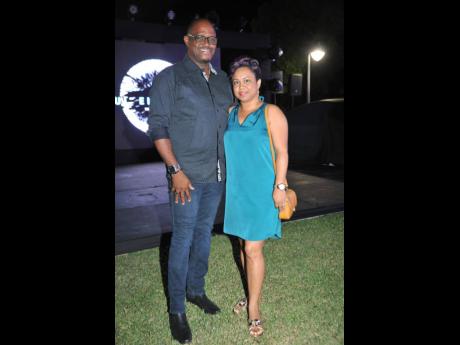Credit: Nicholas Nunes/Photographer Dr Anthonio Anderson (left) and his wife, Micheala Anderson, pose for the camera at the launch of the all-electric Taycan.