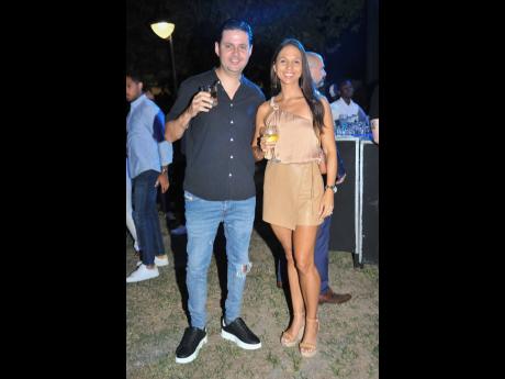Credit: Nicholas Nunes/Photographer Simone Duquesnay (right) embraced the event’s casual charm in Sobelio Boutique with, Sean Duquesnay, chairman of Lithographic Printers.
