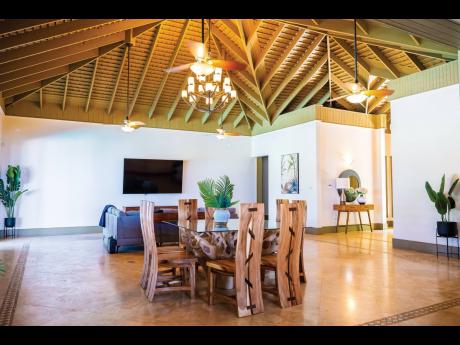 The dining area is surrounded by lots of space and the furniture is kept to a minimum.